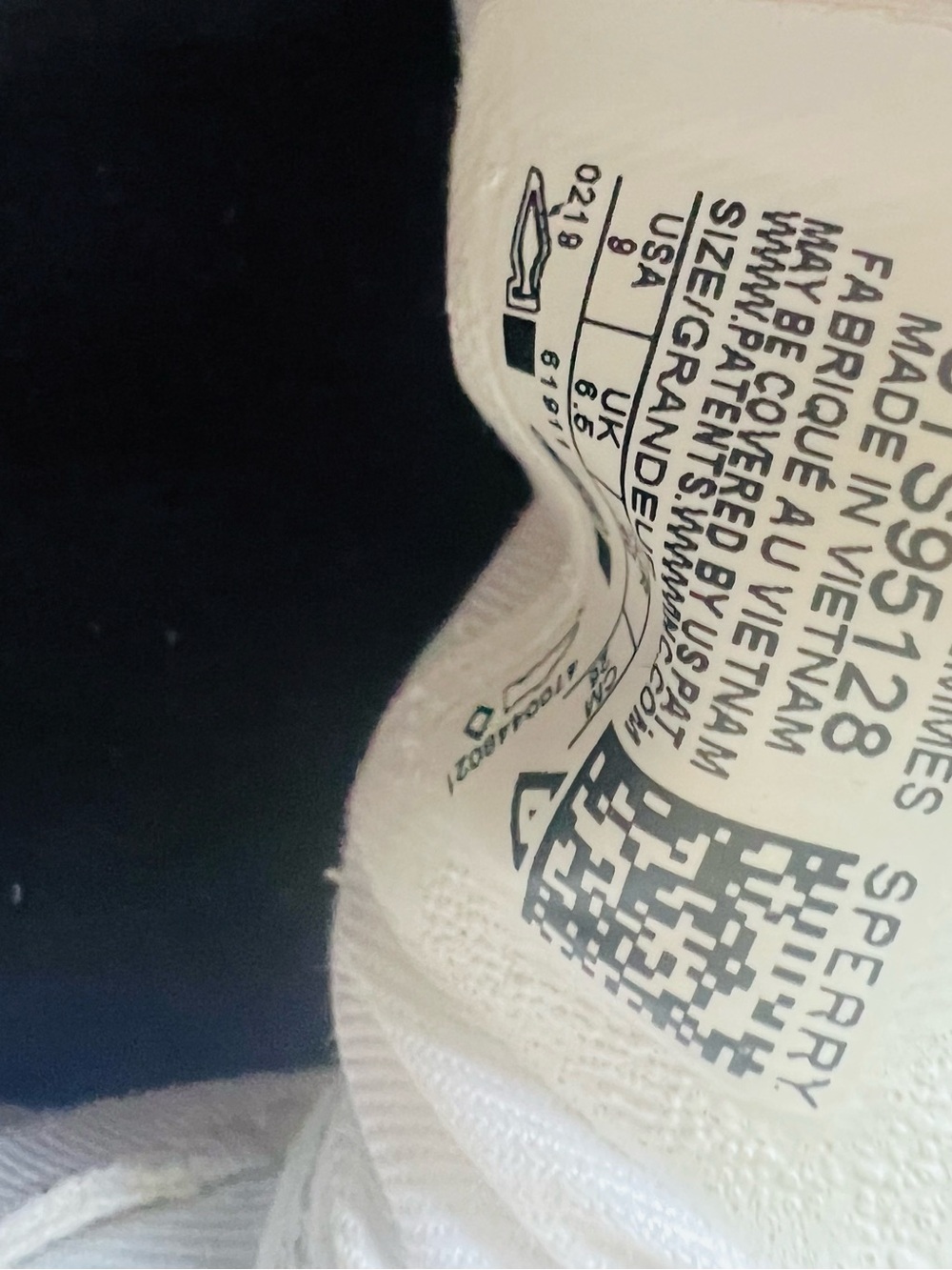 Sperry canvas slip-on sneakers feature prominent raw-hide leather laces - Picture 7 of 7